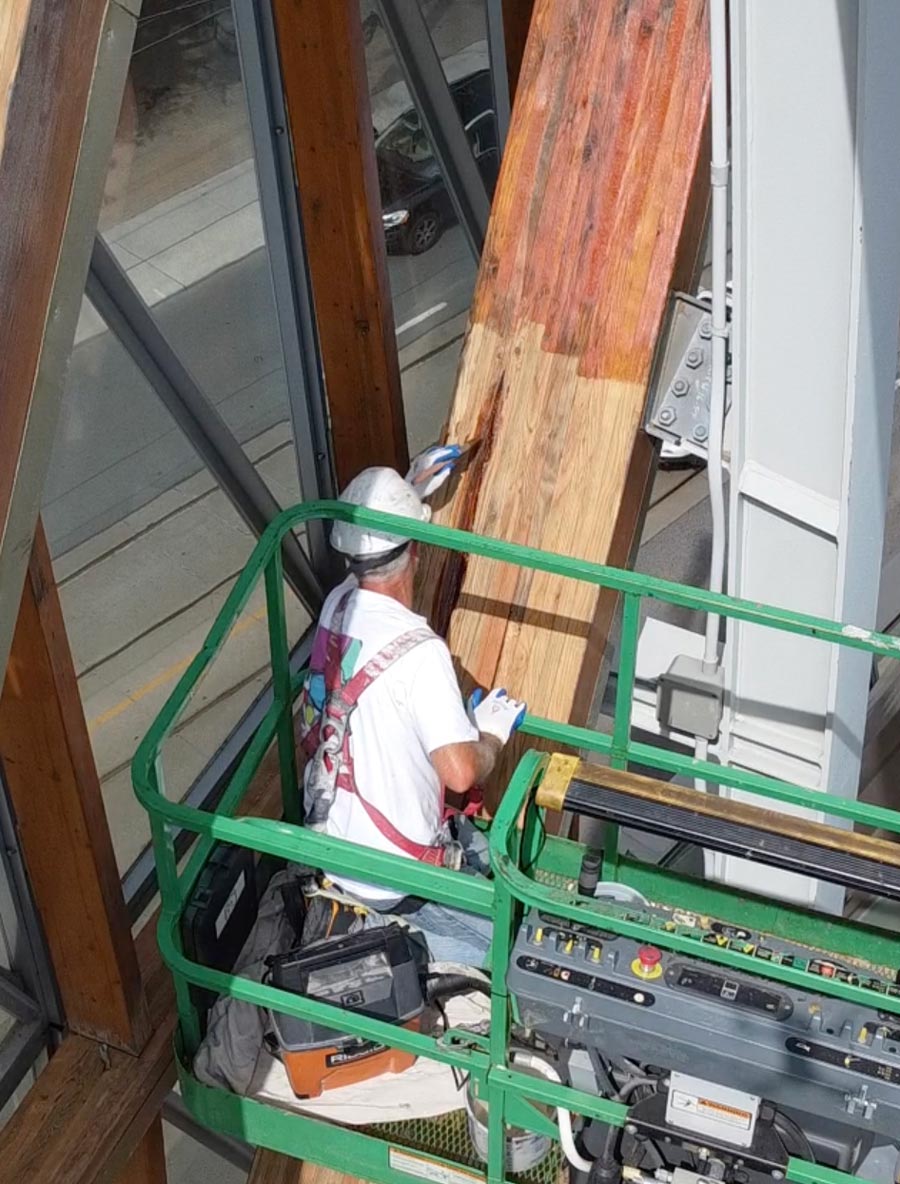 AGO Wood Beam Being Stained